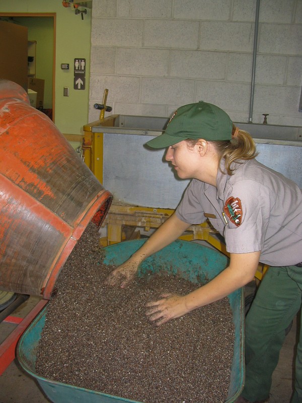 Becky Peterson mixed soil for growing native plants.